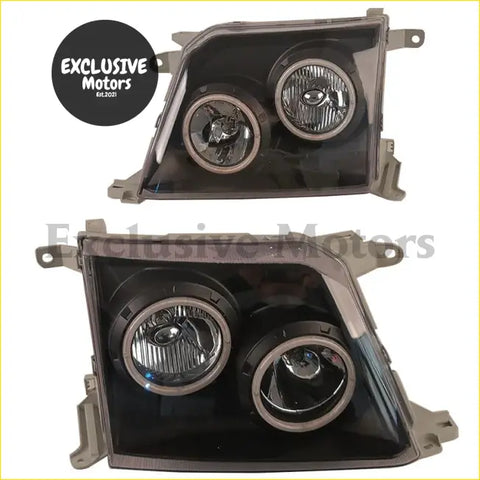 Modified black plastic headlight assemblies with two chrome-rimmed lenses for toyota land cruiser prado 1998-1999