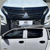 White mitsubishi triton pickup with black front grille and window visors featuring monsoon bonnet guard 2019-2023