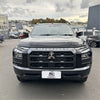 Black Mitsubishi Triton 2024 with Monsoon bonnet guard featuring bold angular grille and chrome accents
