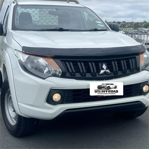 White Mitsubishi Triton 2015-2018 pickup with black Monsoon bonnet guard and hood protector on front grille