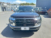 Dark gray metallic mitsubishi triton with bold chrome grille and led headlights featuring monsoon bonnet guard 2024 plus