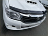 White toyota hilux with black plastic monsoon bonnet guard and chrome grille for 2012-2015 models