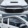 Black plastic window visor for white toyota hilux 2012-2015 shown from the back side in monsoon and bonnet guard set