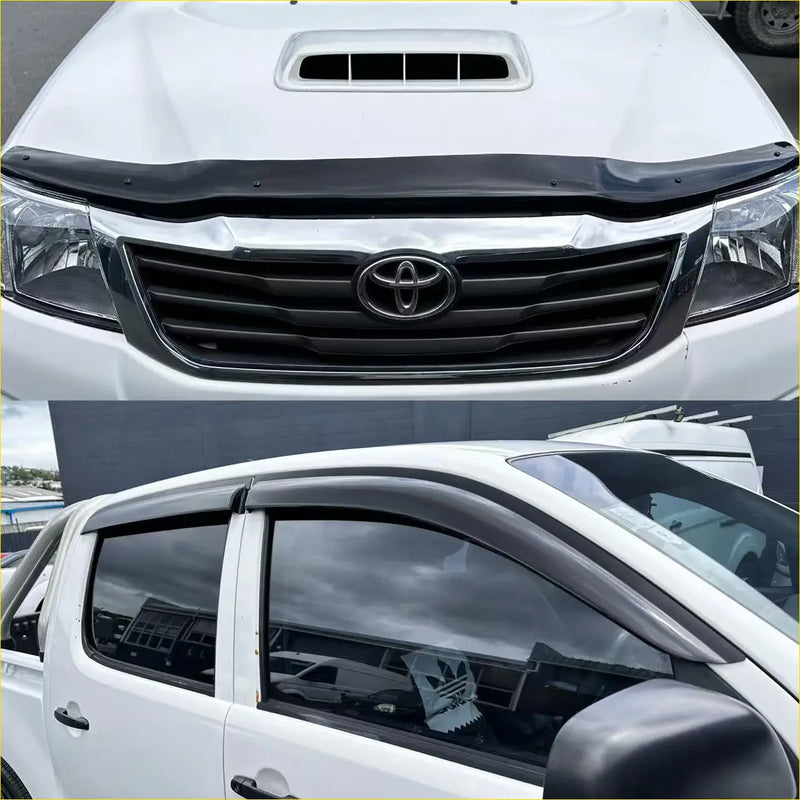 Black plastic window visor for white toyota hilux 2012-2015 shown from the back side in monsoon and bonnet guard set