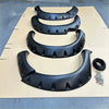 Black plastic monster flare bolt style fender flares with rugged textured surface and mounting points for toyota hilux vigo