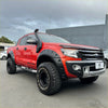 Red ford ranger wildtrak with matte black bolt style monster flares black fender flares snorkel and off-road tires