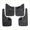 Set of four black plastic mud flaps with molded ridges and mounting holes for toyota fortuner 2010-2015