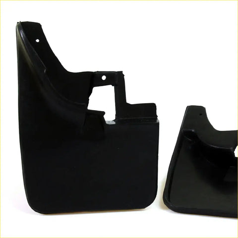 Black plastic mud guard flaps set with molded contours and mounting holes for nissan navara d22 1997-2005