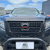 Black nissan navara 2021 with matte finish and nismo honeycomb grille for a bold rugged look