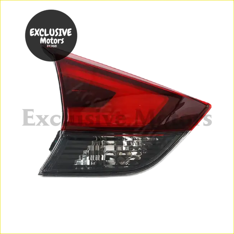 Red and clear plastic nissan x-trail t32 tail light assembly 2017-2019 with sleek angular design back side view