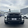 White toyota hilux with black lower style nudge bar compatible with front camera and sensors showing front view