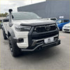 White toyota hilux with black off-road nudge bar compatible with front camera and sensors lower style
