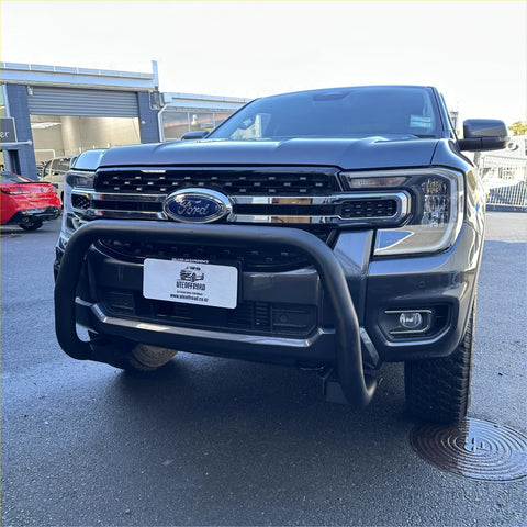 Black ford ranger 2022+ with a chrome grille and rugged nudge bar front bumper guard compatible with front sensor