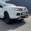 Shiny chrome nudge bar with compatible front sensors mounted on a white mitsubishi triton 2005-2015 pickup truck