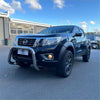 Black nissan navara np300 pickup with chrome nudge bar compatible with front sensors 2015-2020 and black alloy wheels