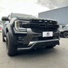 Black ford ranger wildtrak with bold front grille and rugged off-road tires featuring a nudge bar for 2022+ models