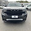 Gray metallic ford wildtrak suv with bold black grille and chrome accents featuring a nudge bar for ford ranger 2022+