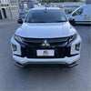 White mitsubishi triton 2019-2023 with black metal nudge bar and black front grille and bumper visible from front