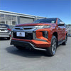 Vibrant orange Mitsubishi Triton 2019-2023 with black nudge bar featuring bold grille and chrome accents