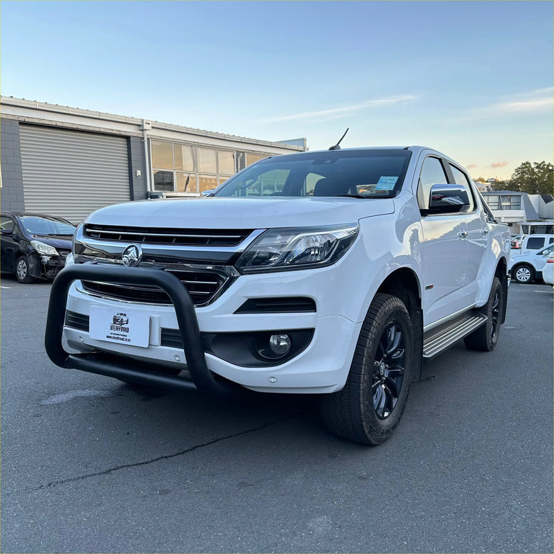 White holden colorado pickup with matte black nudge bar and black alloy wheels showing front bull bar