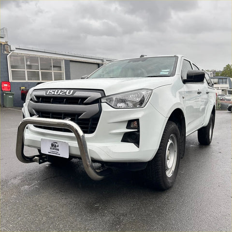 White isuzu d-max 2021-2023 with chrome nudge bar and bull bar showing front side of the pickup truck