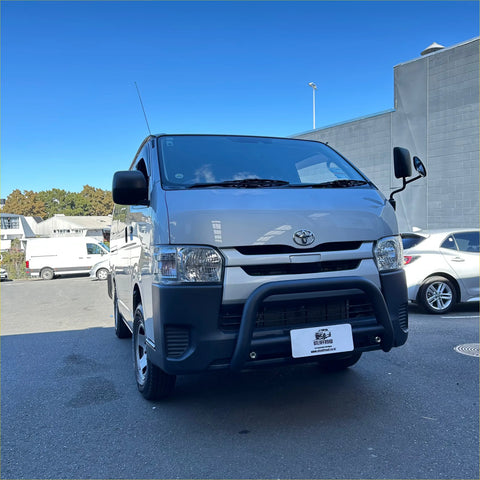 Silver toyota hiace narrow body van with matte black nudge bar guard and black side mirrors 2005-2019 model