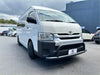 White toyota hiace van with black front bumper and mirrors featuring matte black nudge bar for wide body 2005-2019 model