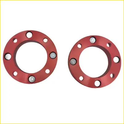 Red metallic front coil spacers with evenly spaced bolt holes for 1 inch lift on holden colorado and toyota landcruiser