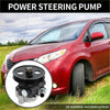 Close-up of black power steering pump with metallic fittings and pulley for toyota sienna 2004-2006 in front of red minivan