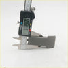 Digital caliper with black body silver jaws measuring 0.90 mm shown for quarter glass lock latch mazda b2000 b2200 b2600 bravo