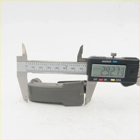 Gray plastic camera grip measured by digital caliper for quarter glass lock latch on mazda b2000 b2200 b2600 bravo