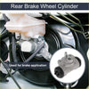 Silver metallic rear brake wheel cylinder with black rubber seals and threaded ports installed in toyota rav4 2001-2005 back side