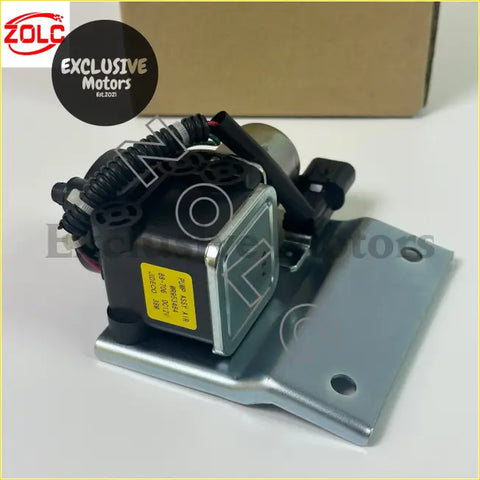 Black and silver rear differential lock air pump with yellow label mounted on metal bracket for Mitsubishi Pajero Montero