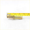 Yellow zinc-coated metal anchor bolt with threaded sections and hex nut for rear drum brake shoes adjuster on toyota hilux