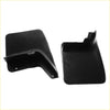 Black plastic rear mud guard flaps for Nissan Navara D22 1997-2004 with molded contours and mounting holes visible from back side