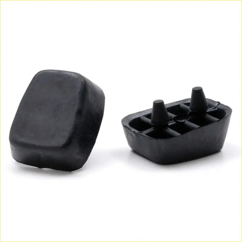 Black rubber rear bumper bar ends with conical protrusions for Mazda Familia 4-door 1964-1977 shown from back side