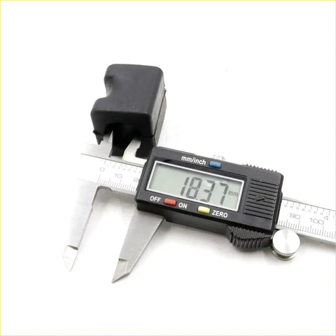 Black rubber rear stabilizer shaft for nissan leopard coupe 1980-1986 shown with digital caliper measuring 18.37 mm