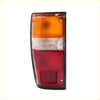 Rear tail light lhs for toyota hilux 1984-1988 black frame with amber clear and red lens sections back side view
