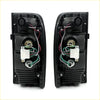 Black plastic rear tail light assemblies for toyota hilux ln154 ln169 ln172 kzn165 d4d showing back side wiring and components
