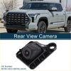 Black plastic rear view camera with circular lens and mounting bracket for toyota tundra 2010-2013 shown from back side