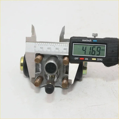 Silver metal rear wheel brake cylinder with brass fittings and black rubber boot for datsun nissan 720 1979-1986