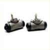 Pair of gray cast iron rear wheel brake cylinders with black rubber caps and threaded fittings for toyota hilux