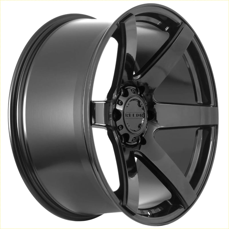 Black gloss finished alloy wheel with five spokes and reckon logo on center cap from recon delta gloss black series
