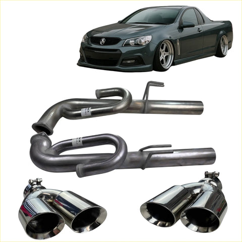 Back view of shiny chrome dual-exhaust redback performance anti drone tail pipes on dark green holden utility vehicle