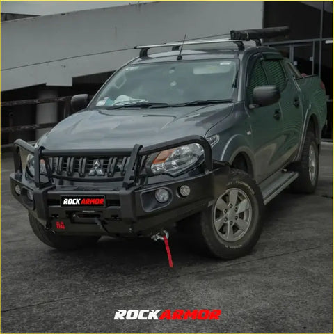 Black rockarmor elite steel bullbar front bumper with integrated winch and red recovery strap for offroad 4wd ute