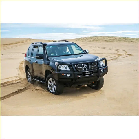 Black Toyota Land Cruiser Prado with rugged steel Rockarmor Elite bullbar featuring offroad lights for 4wd use