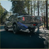 Back of black matte mitsubishi triton ute with rockarmor elite steel rear step tow bar and black alloy wheels for 4wd offroad