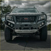 Gray armored front bumper with integrated lights and nissan navara grille for offroad 4wd ute protection