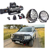 Black steel winch with coiled cable and remote paired with two led light bars for rockarmor gt hoop 4wd ute bullbar
