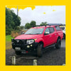 Vibrant red mitsubishi triton pickup with black steel rockarmor gt hoop bullbar and off-road roof rack accessories